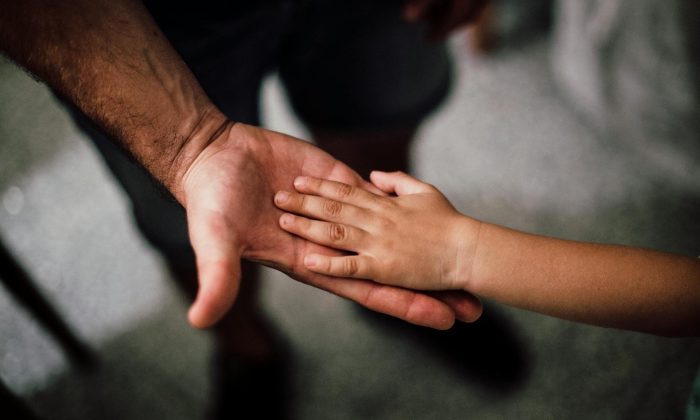 father son hand in hand